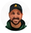 Small circular portrait of a bearded man wearing a dark cap and green shirt.