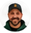 Circular headshot of Alex Johnson, wearing a dark cap and dark shirt.