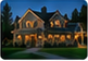 Nighttime illuminated-house thumbnail for Williams Family.