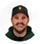 Circular portrait avatar of Alex Johnson, a dark-haired bearded man wearing a green shirt.