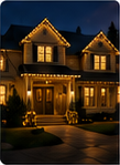 Portrait-oriented nighttime photo of a larger warmly lit holiday house.