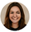 Circular headshot of Jennifer Williams, smiling woman with long dark brown hair.