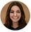 Circular headshot of Lisa Martinez, smiling woman with long brown hair.